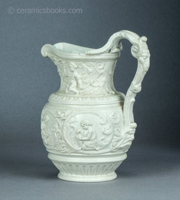 White stoneware moulded jug. 'Four Seasons' by Charles Meigh & Son. c.1852. AP/1454. Obverse angle.