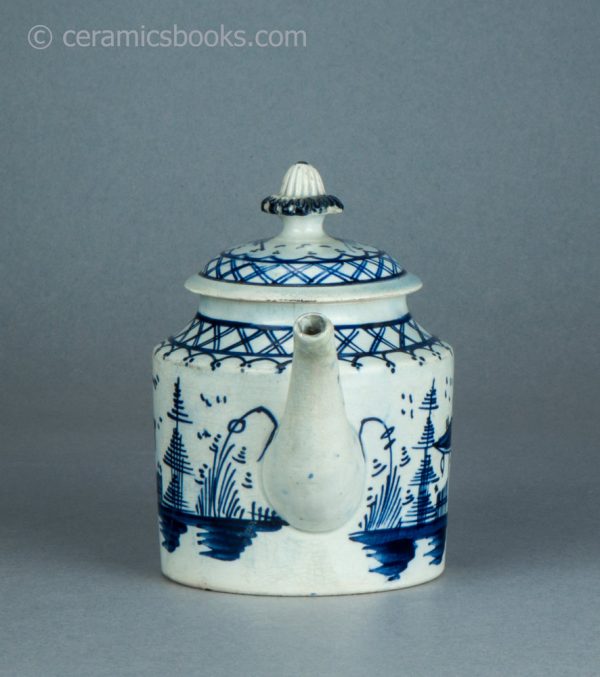 Pearlware cylindrical bachelor teapot with underglaze blue painted 'Chinese House' design. c.1785-1800. AP/1488. Front.