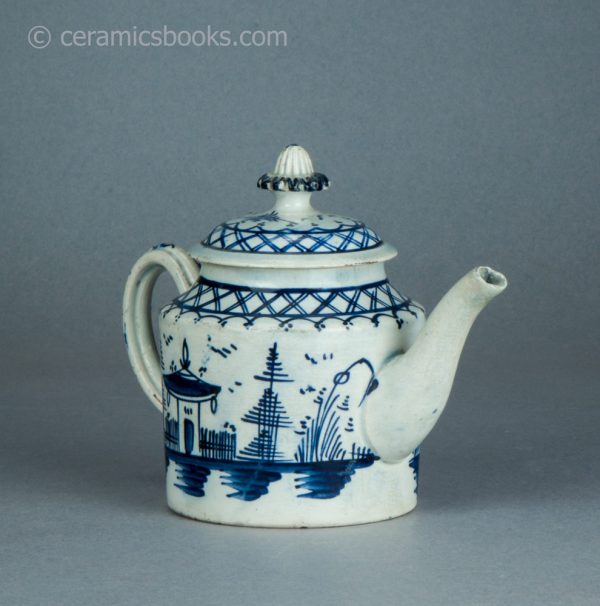 Pearlware cylindrical bachelor teapot with underglaze blue painted 'Chinese House' design. c.1785-1800. AP/1488. Front reverse.