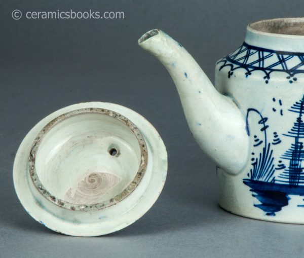 Pearlware cylindrical bachelor teapot with underglaze blue painted 'Chinese House' design. c.1785-1800. AP/1488. Inside lid.