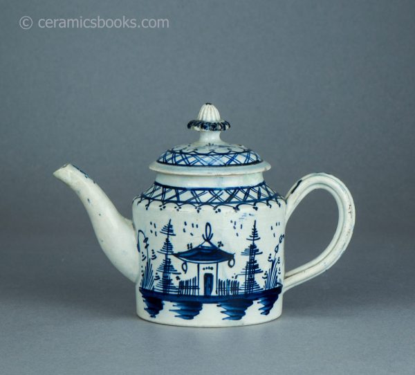 Pearlware cylindrical bachelor teapot with underglaze blue painted 'Chinese House' design. c.1785-1800. AP/1488. Obverse.