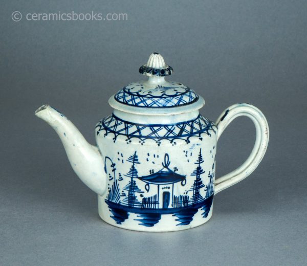 Pearlware cylindrical bachelor teapot with underglaze blue painted 'Chinese House' design. c.1785-1800. AP/1488. Obverse above.