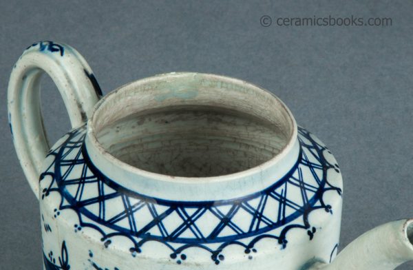 Pearlware cylindrical bachelor teapot with underglaze blue painted 'Chinese House' design. c.1785-1800. AP/1488. Rim.