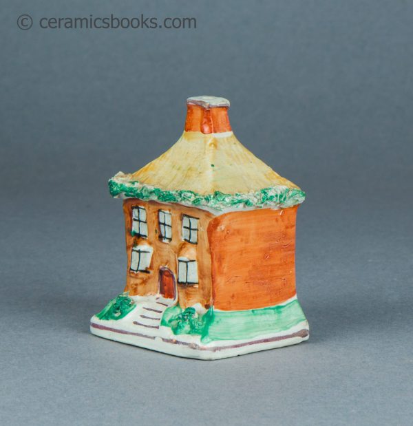Tiny Staffordshire cottage moneybox. c1870-1920. AP/1617. Angle.