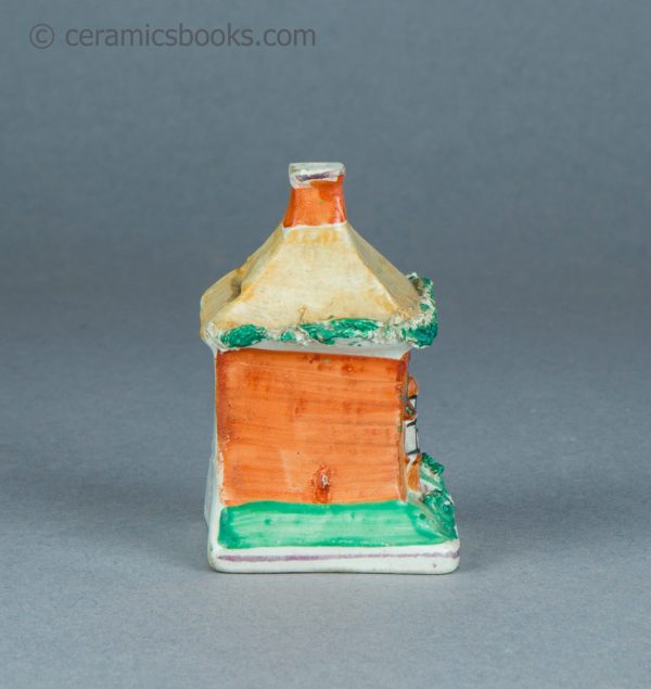 Tiny Staffordshire cottage moneybox. c1870-1920. AP/1617. Side.