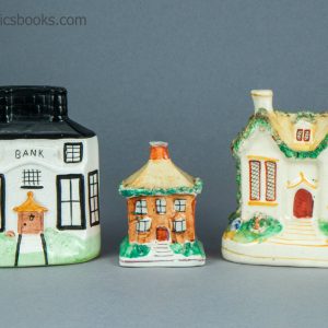 Three Staffordshire moneyboxes. Bank building and two cottages. c.1870-1920.