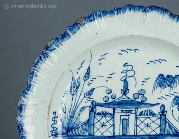 Pearlware shell edge plate. Underglaze blue painted 'Chinese house' pattern. Joshua Heath. c.1785-1800. AP/1703. Rim chip B.