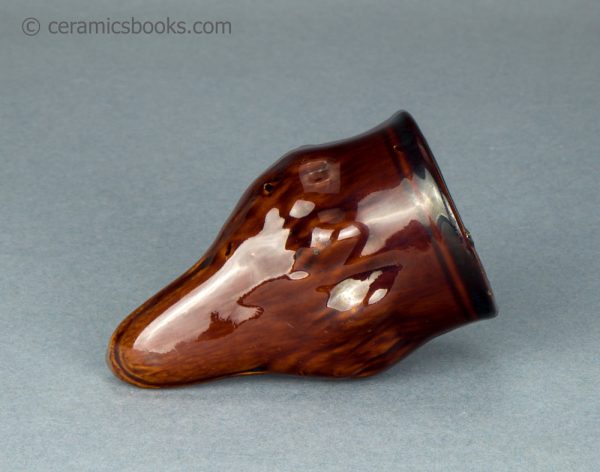 Treacleware fox head stirrup cup. c.1835-1865. AP/1062. Base.