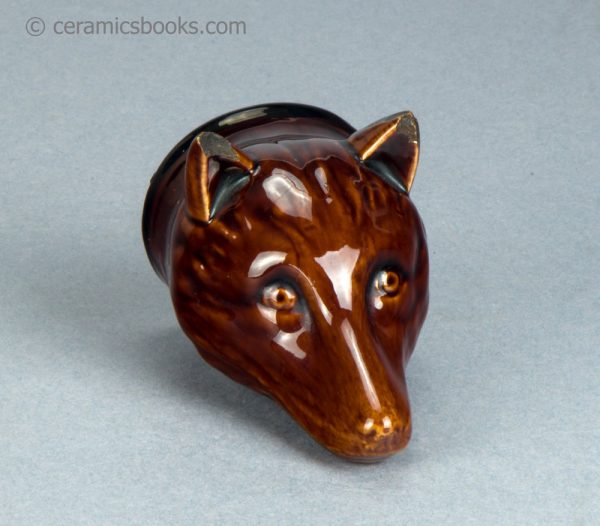 Treacleware fox head stirrup cup. c.1835-1865. AP/1062. Front angle.