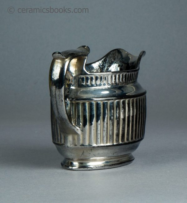Silver lustreware cream jug with fluting. c.1820-1825. AP/1069. Back.