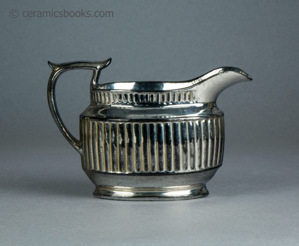 Silver lustreware cream jug with fluting. c.1820-1825. AP/1069. Reverse.