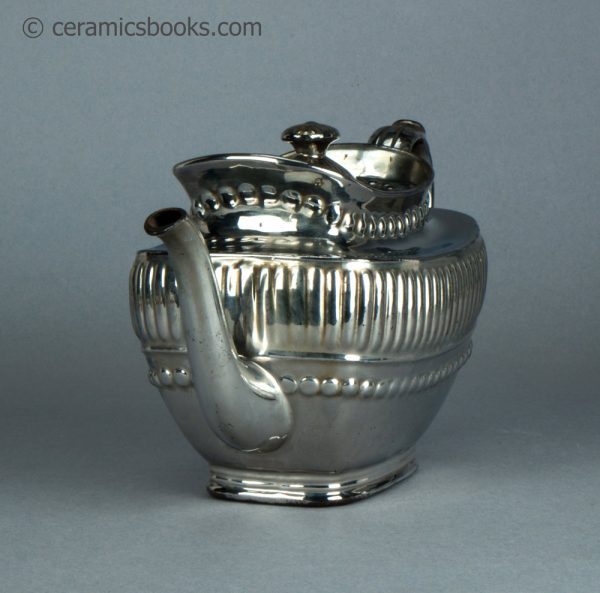 Silver lustreware teapot with ball and gadroon moulding. c.1820-1825. AP/1070. Front.
