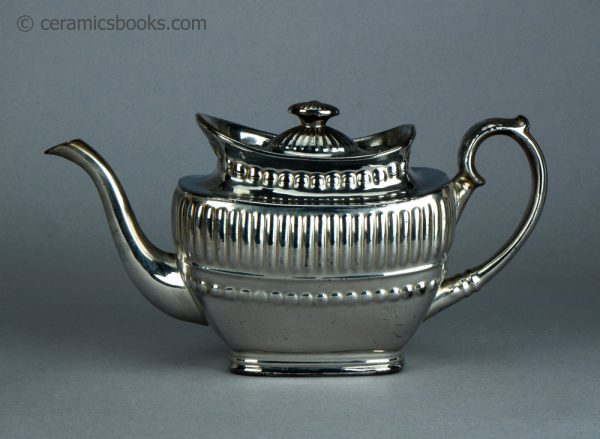Silver lustreware teapot with ball and gadroon moulding. c.1820-1825. AP/1070. Obverse.