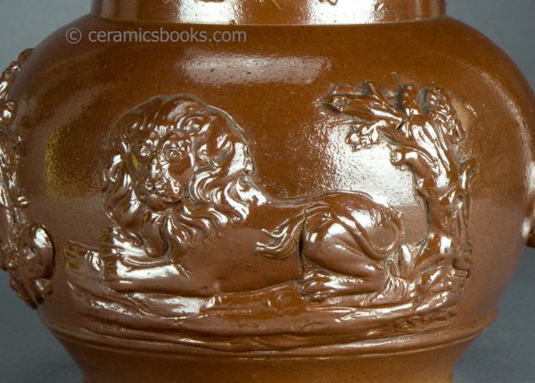 Brown saltglazed stoneware jug with Union and Oddfellows sprigs. Probably Brampton. c.1840-1850. AP/1355. Obverse sprig.