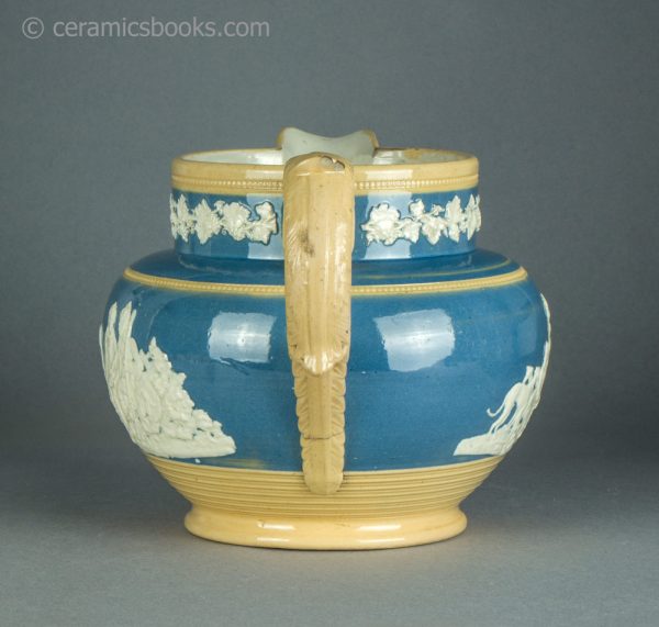 Large yellowware jug with blue slip ground and white sprigs. c.1840-1860. AP/1411. Back.
