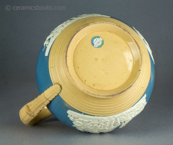 Large yellowware jug with blue slip ground and white sprigs. c.1840-1860. AP/1411. Base.