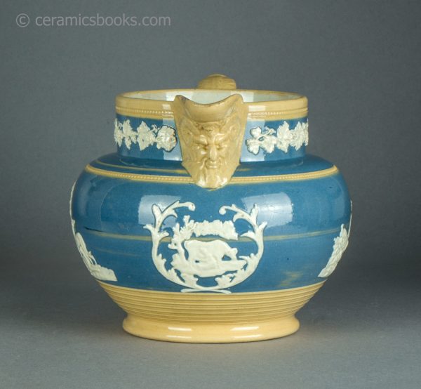 Large yellowware jug with blue slip ground and white sprigs. c.1840-1860. AP/1411. Front.