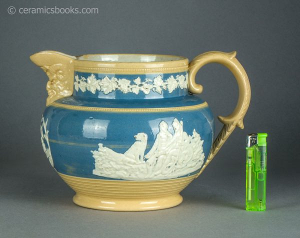 Large yellowware jug with blue slip ground and white sprigs. c.1840-1860. AP/1411. Obverse with scale.
