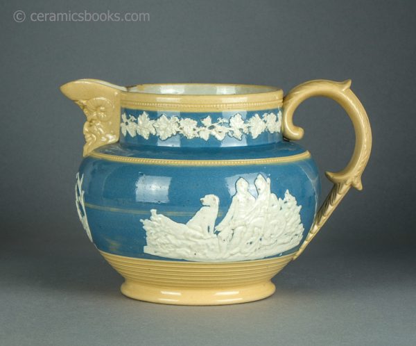 Large yellowware jug with blue slip ground and white sprigs. c.1840-1860. AP/1411. Obverse.