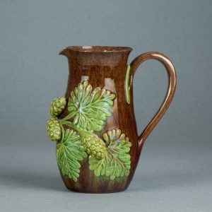 Belle Vue Pottery, Rye, Sussex, earthenware jug with hop sprigs. c.1870-1920. AP/1568. Obverse.