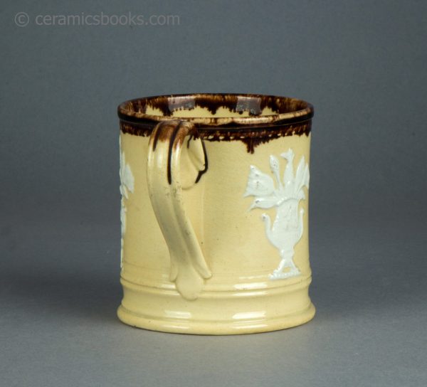 Dipped treacleware yellowware mug with pineapple sprigs. c.1840-1860. AP/1591. Back.