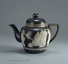 White teapot with black ground and white Greek figures. Attributed to F. & R. Pratt of Fenton, Staffordshire. 125mm High. c.1850-1870. AP/960.