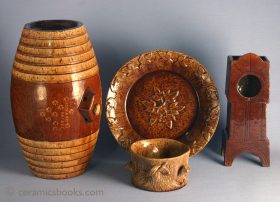 Group of Sussex earthenwares. The barrel inlaid "EDWARD SAXBY", the pocket-watch holder inscribed with the years of birth and death of John Larwood. C19th.